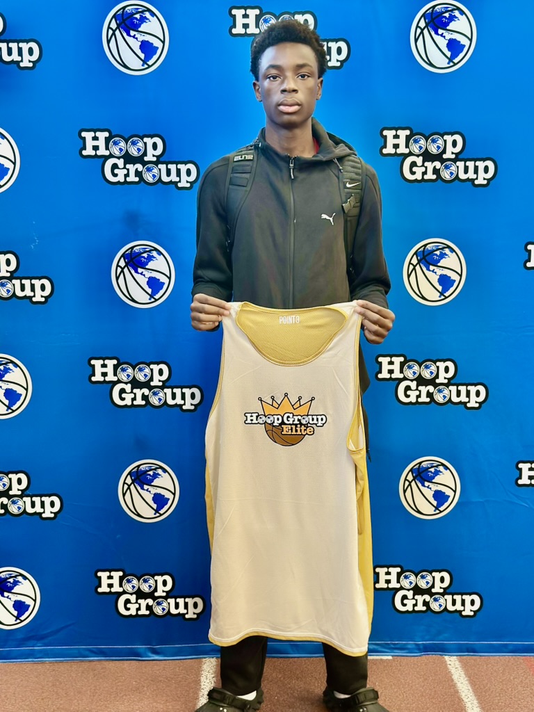 Miracle Oruchukwu holding a Hoop Group Elite jersey